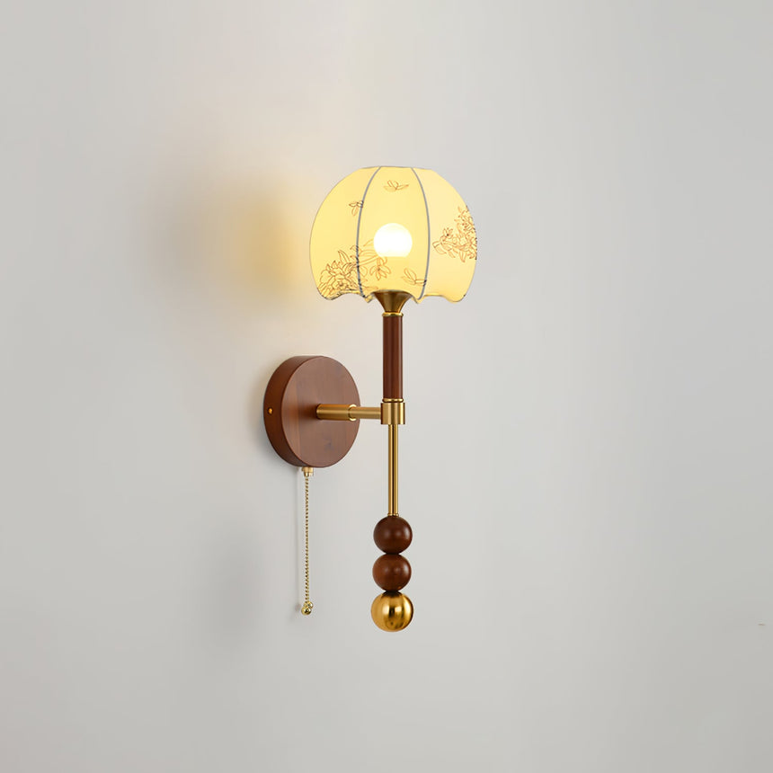 Cut amber glass shade lit, the pattern of the glass showing in the light