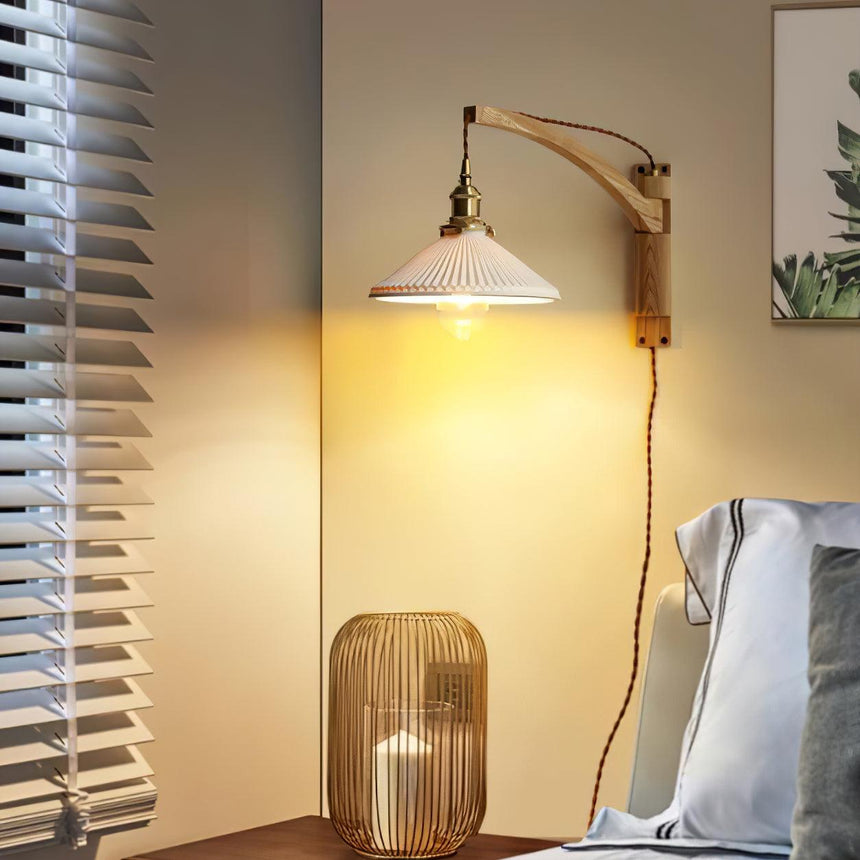 The curved arm version lit beside a window with open blinds