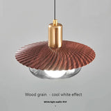 The disc lit with cool white light showing the smoked glass below the grain