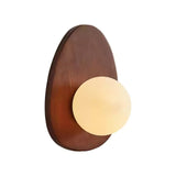The walnut teardrop plate seen from the front with the opal globe unlit
