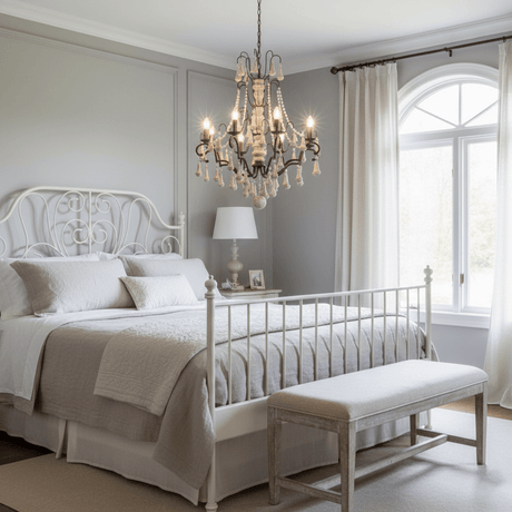 Lit above a white bed with an arched window and a bench at its foot