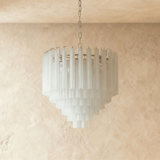 The frosted glass tubes switched off, reading white against a pale ceiling