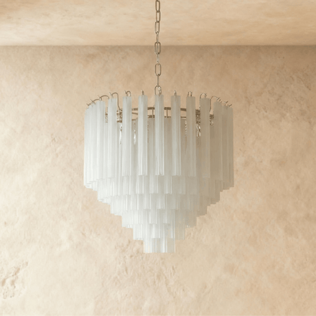 The frosted glass tubes switched off, reading white against a pale ceiling