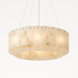 A drum of white alabaster panels lit, hung on four thin cables