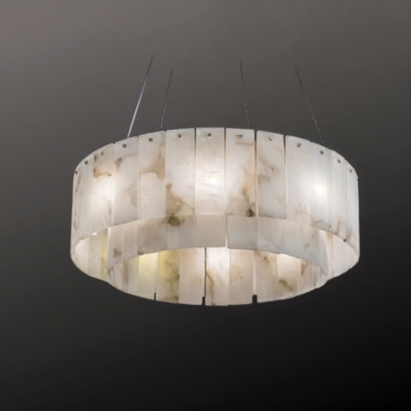 The drum lit on a dark ground, two bands of stone panels stacked