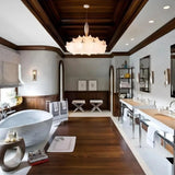Layered silk pendant hung in a paneled room with a freestanding tub