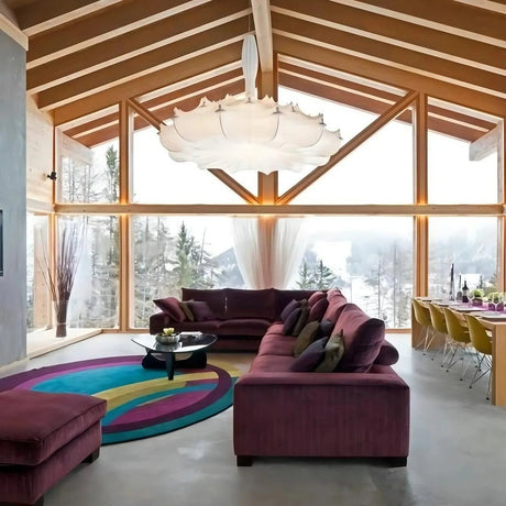 Layered silk pendant under a timber roof with a seating area below