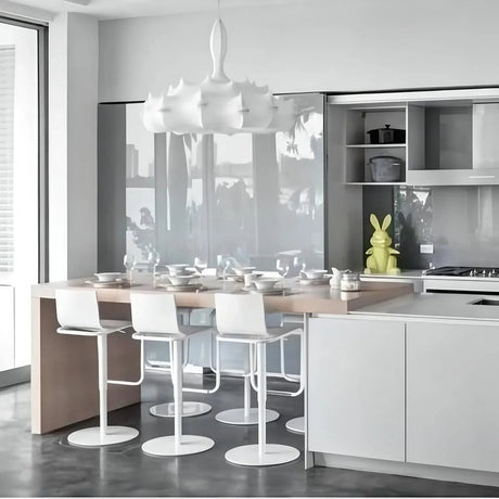 Two layered silk pendants above a kitchen counter
