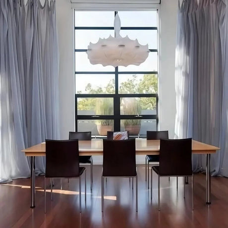 Layered silk pendant hung in front of tall windows