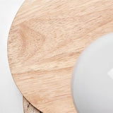 Close view of the wood grain on the front disc beside the glass orb