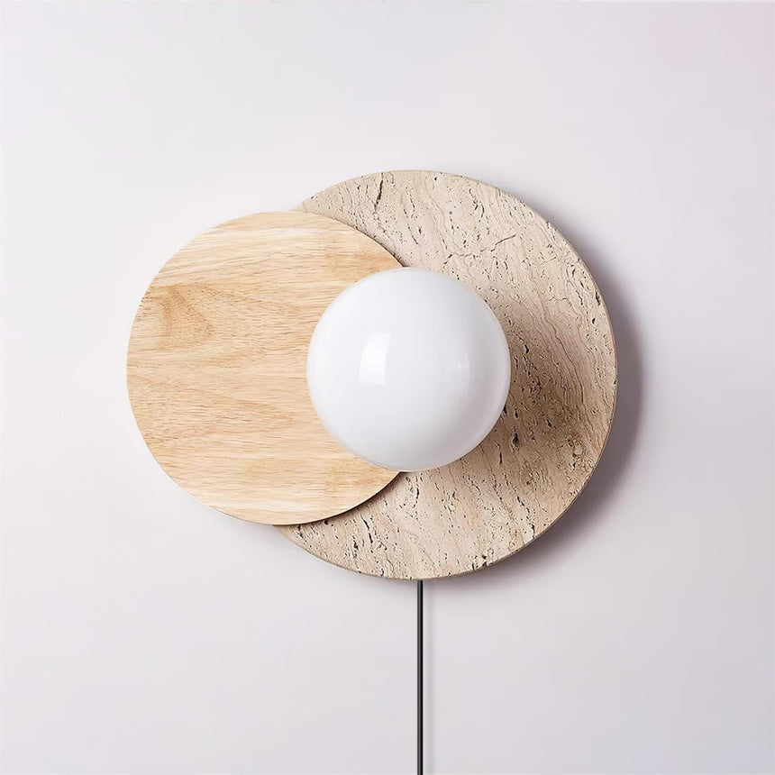 Light wood disc over a travertine disc with a white glass orb, unlit