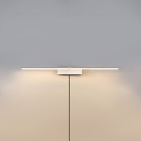 The white version lit on a pale wall, the cord hanging below the offset block
