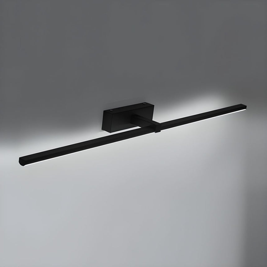 The black bar lit on a gray wall, the diffuser bright along its underside