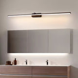 Long bar lit above a wide mirror cabinet over a walnut vanity unit