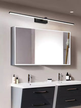 Bar lit above two framed mirrors over a dark double vanity with white basins
