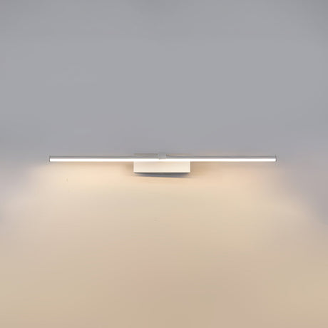 The white version lit, a flat bar washing the wall below it with warm light