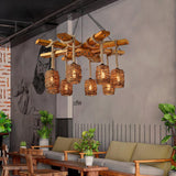 Hung over a low sofa and plants against a gray wall in a lounge
