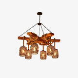 The six shade version lit against a plain pale wall, rope coils looped over the timber beams