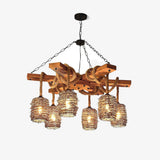 Crossed timber beams on chains carrying six woven wicker barrel shades