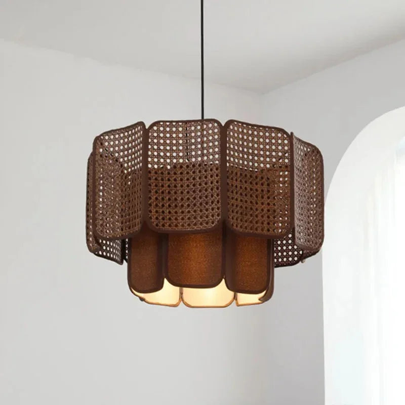 Close view of the brown scalloped wicker shade and its overlapping tiers