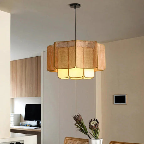 Wicker hanging lamp lit in a living room with a television