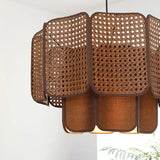 Two brown wicker hanging lamps side by side showing the scalloped weave