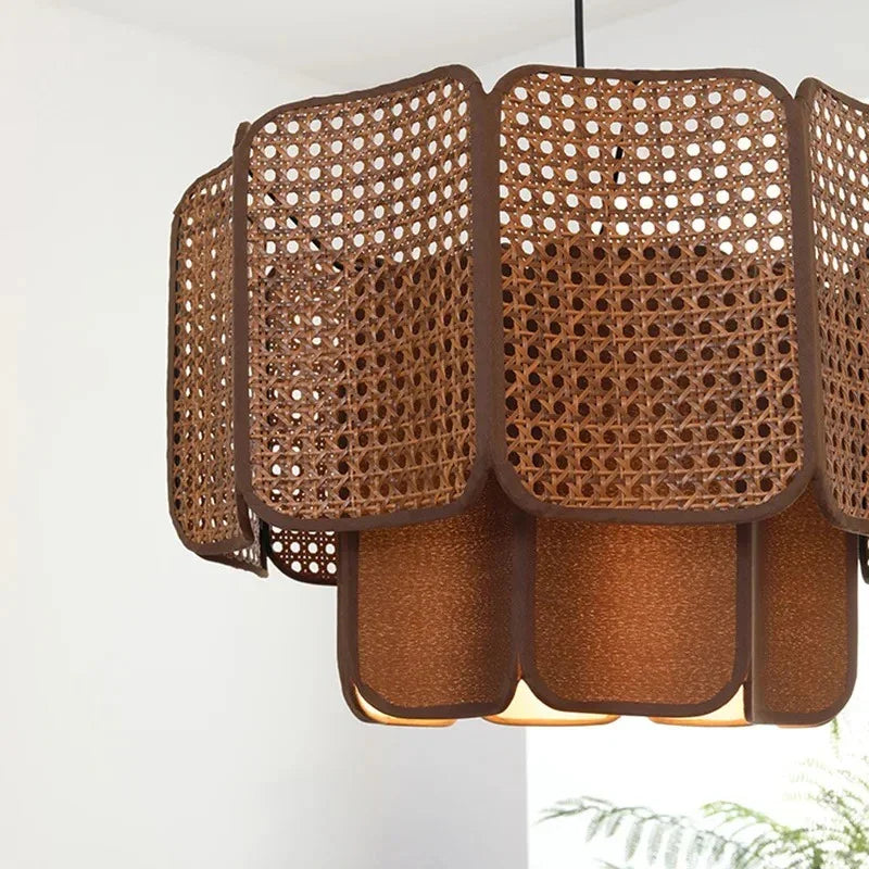 Two brown wicker hanging lamps side by side showing the scalloped weave
