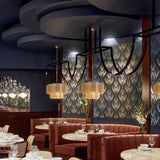 Several wicker hanging lamps in a restaurant interior