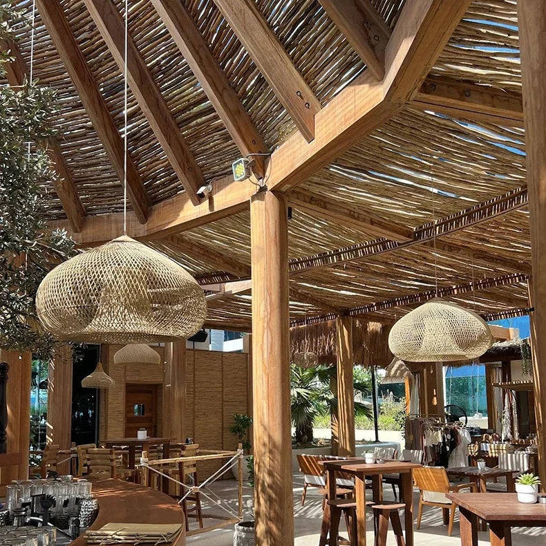Wicker shades above a bar counter in a warm room