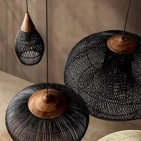 Two black wicker domes hung side by side in a pale room