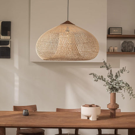 Wicker dome hung against a pale plaster wall