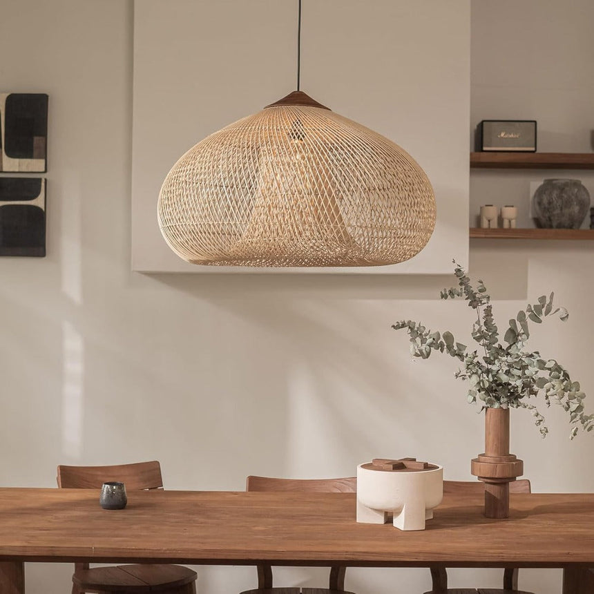 Wicker dome hung against a pale plaster wall