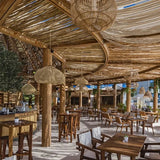 Wicker shades under a covered terrace roof