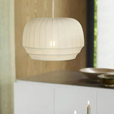 Knitted cloth shade above a white kitchen counter