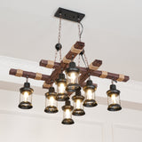 Seen from below at a ceiling corner, the beams crossing above the lit lanterns