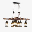 Two crossed wood beams carrying eight small caged glass lanterns on short drops