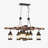 Two crossed wood beams carrying eight small caged glass lanterns on short drops