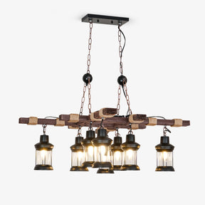 Two crossed wood beams carrying eight small caged glass lanterns on short drops
