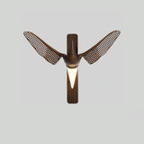The walnut version seen from the front, wings raised either side