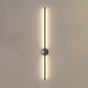 The black rod lit from top to bottom, the round hub catching the light