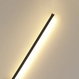 The rod seen at an angle, the lit face turned toward the wall behind it