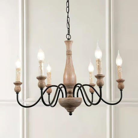 The six candle bulbs lit against a paneled white wall and a doorway
