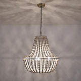 Lit close under a ceiling, the strands throwing a soft radiating shadow