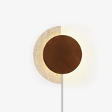 Wood plug in wall sconce, a walnut disc over a travertine crescent