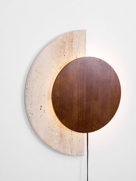 The largest size seen straight on, walnut disc on a pale stone crescent