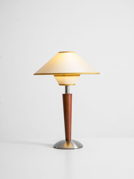 Wood table lamp with the beige two tier shade on a plain background