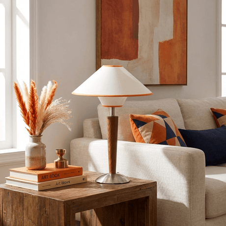 Wood table lamp on a console table beside a pale sofa