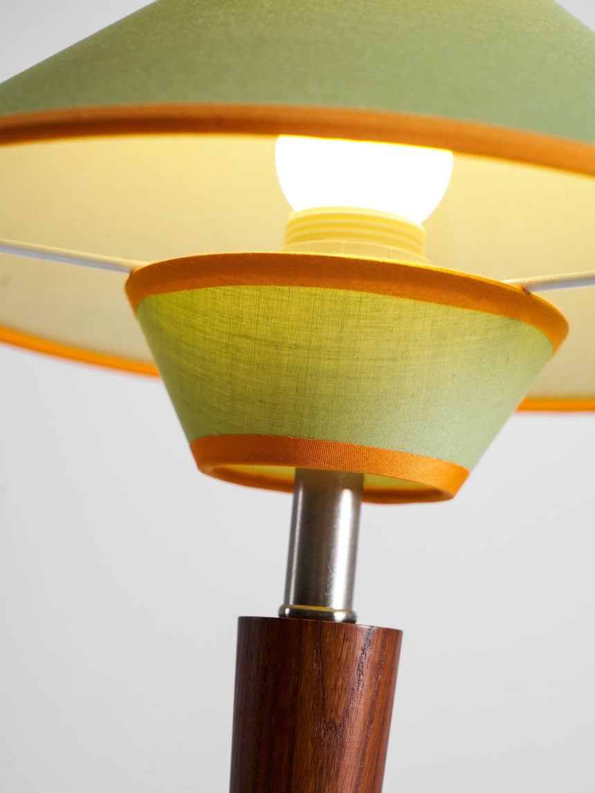 Close view of the two lit tiers and the contrast trim of the shade