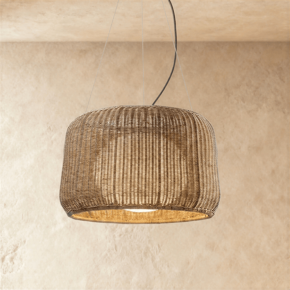 A woven wicker drum shade with a pinched waist, open at the base