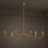 The gold version against a dark paneled wall, six candle arms lit